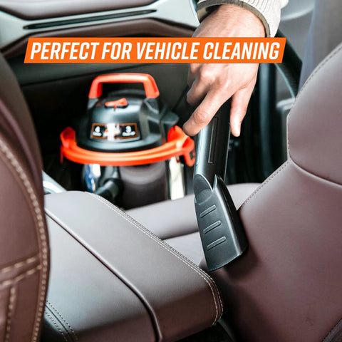 Person using Powerful 900W 3 Peak HP Stainless Steel Wet Dry Vacuum With 4 Gallon Tank in vehicle with attachment