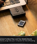 ProGrade CFexpress Type A single slot mobile card reader with USB C 3.2 Gen 2 next to laptop for fast file transfers on-the-go.