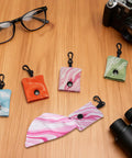 Grab And Go Ultra Portable Microfiber Cleaning Cloths With Keychain For Eyeglasses Sunglasses And Camera Lenses 4 Pack on table