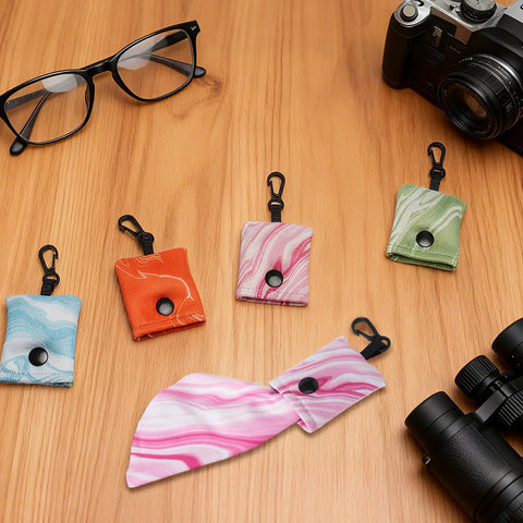 Grab And Go Ultra Portable Microfiber Cleaning Cloths With Keychain For Eyeglasses Sunglasses And Camera Lenses 4 Pack on table