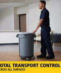 Employee using Dolly For Heavy Duty 20 To 55 Gallon Waste Cans With Easy Mobility And Secure Twist Lock Supports Up To 250 Pounds