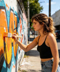 Person using Flat Painting Brush Set For DIY Home Projects And Crafting 7.87 Inch By 1.96 Inch Flat Shader on graffiti wall