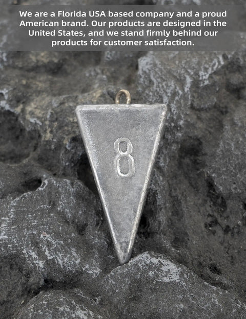 Pyramid Lead Fishing Sinkers For Saltwater 3oz Each 5 Pack Beefy Pyramid Weights resting on rocky surface