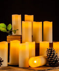 Flameless LED Candles Set Of 12 Ivory Real Wax Pillar Candles 2.2 Inch Diameter By 5 Inch Tall with pine cones and leaves