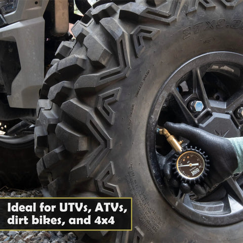JACO Elite low-pressure tire gauge, 30 PSI, with brass chuck, close-up on ATV tire valve