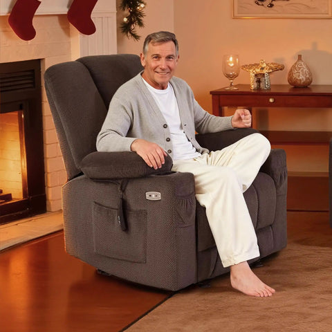 Man seated in Zero Gravity Power Recliner Chair With Heat And Massage, USB Type C Ports, Cup Holders, And TV Mode, Grey fabric.