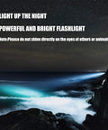 Night scene with Beast Bright 600 Lumen Rechargeable Spotlight Flashlight beam over ocean cliffs.