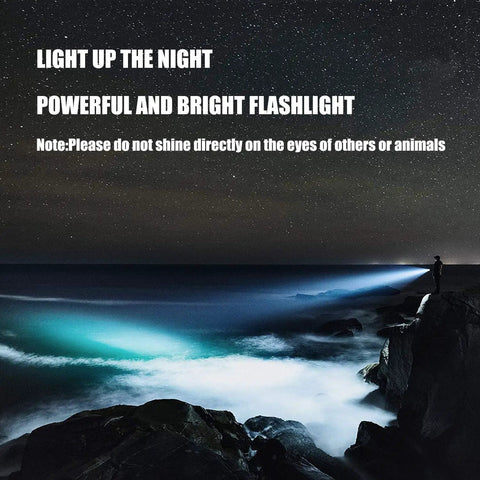 Night scene with Beast Bright 600 Lumen Rechargeable Spotlight Flashlight beam over ocean cliffs.