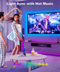 Couple dancing in living room with 60 To 65 Inch TV Backlight Kit With App Control RGBWW LED Strips lighting up TV screen