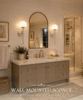 KoKo&Yukina 2 Pack Nickel Mid Century Wall Sconce Bedroom Bulb Included in a stylish bathroom with marble countertop.