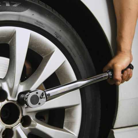 Using Half Inch Drive Click Torque Wrench Pro Grade With Ten To One Hundred Fifty Foot Pounds Range on car wheel lug nut