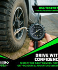 Three In One Tire Inflator And Gauge With Heavy Duty Air Chuck Braided Stainless Hose Large Analog Dial Solid Brass Fittings For Truck And RV 0 To 100 Psi No Battery Needed Inflate Check And Bleed In One Tool measuring tire pressure on SUV