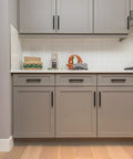 Kitchen with grey cabinets fitted with 60 Pack Matte Black Cabinet Pulls 7-3/8 Inch Length Stainless Steel Kitchen Drawer Handles 5 Inch Center-To-Center Hole Spacing With Mounting Template For A Slick Easy Install.