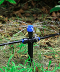 Adjustable 360 Degree Drip Irrigation Emitters For One Quarter Inch Tubing Push To Fit Garden Watering System in use with arrow stake