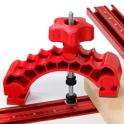 Knockout Rock Solid Micro Dot Drill Press Table Kit dual knuckle clamp with red adjustment knob on a drill press table.