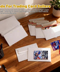 110 Pack White Trading Card Shipping Envelopes 7x4.35 Inch Self Adhesive Mailers on wooden desk with cards inside
