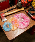 Heavy Duty Fire Alarm Dust Caps For Paint Day The 96 Piece Universal Flexible Heat Detector And Sprinkler Guard on a wooden table.