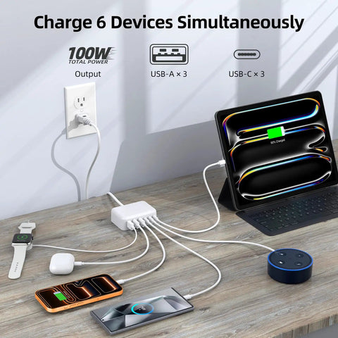 6 In 1 USB Charging Station For Multiple Devices, 100W Fast Charging Hub powering phone, tablet, watch, and e-reader on desk