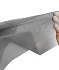Hand holding gray mesh sheet of Adjustable 48 X 106 Fiberglass Window Screen Kit For Windows Doors And Patio DIY Pro Grade Replacement