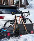 Foldable Hitch Carrier 60x24x6 Inch With 500lb Capacity attached to SUV carrying bike and gear