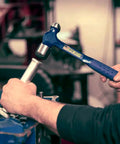 Mechanic using 32 Oz Ball Peen Hammer For Metalworking, Forged Steel Construction, Shock Reduction Grip, USA Made Workhorse