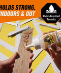 Gorilla Clear Glue 3.75 oz bottle applying clear glue to wood plank (close-up)