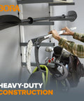 Person organizing equipment on a Six Level Wall Mounted Metal Lumber Rack For Garage Organization And Heavy Duty Wood Storage Shelf Pipe Holder Plywood Sheet Stand Optimizing Your Workspace In A Flash.