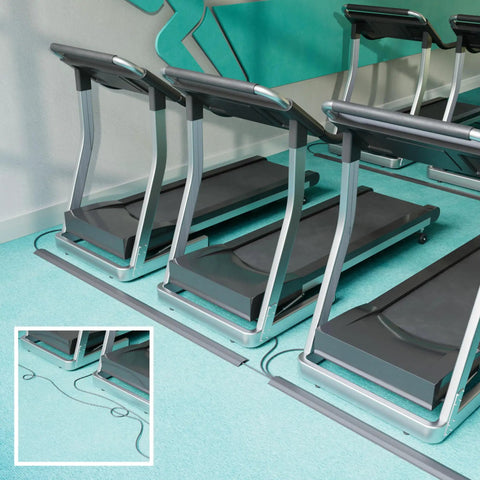 Treadmills with 30ft Floor Cord Cover Linkable Cable Protector on gym floor