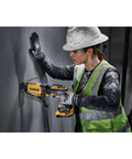 Worker using 20V Max Brushless Drywall Screw Gun Tool Only DCF630B with Variable Speed, Four Modes on drywall panel.