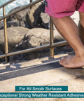 Person walking on stairs with Long 12 Inch By 35 Foot Anti Slip Traction Tape With Roller For Easy Install Non Slip Grip Tape on step