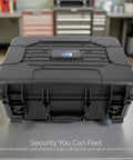 Front view of Hard Shell Wireless Microphone Case With Customizable Foam Insert For Sennheiser Shure Audio Technica Nady And VocoPro Receivers And Transmitters Built For Rugged Travel Gig Ready Protection showing black rugged exterior on a table.