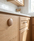 Khaki Wood Hole Button Plugs With Mushroom Head on kitchen cabinet, showing seamless integration for concealing screw holes.