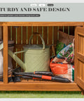Open Weatherproof Acacia Wood Outdoor Storage Cabinet With Two Magnetic Doors And Three Level Storage showing tools inside