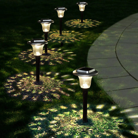 Solar Outdoor Path Lights 6 Pack With Lit Color Changing And Static Warm Glow Modes, illuminating a garden pathway.
