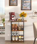 Compact Three Tier Floor Standing Coffee Bar Shelf For Cozy Corner Space Saving Farmhouse Style Coffee Station Perfect As A Small Coffee Table And Cabinet In Living Room Or Dining Room Brown And Black Finish with coffee supplies.