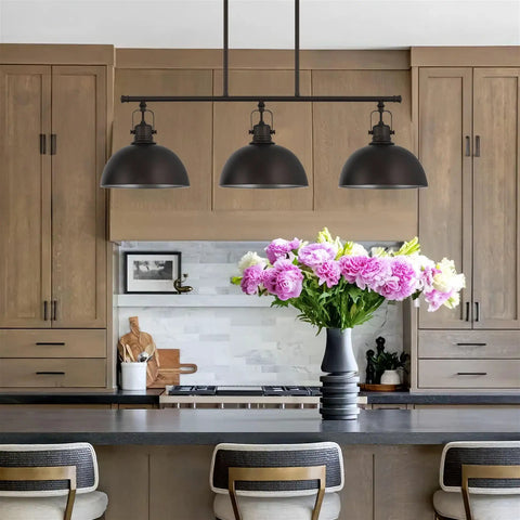 34 Inch Three Light Industrial Kitchen Island Pendant With Dome Shade Lighting Swivel Joints Brushed Nickel Finish Modern Farmhouse Style Chandelier hanging over kitchen island with flowers