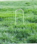 Heavy Duty Galvanized U Shaped Ground Stakes Pack Of 50 For Garden Membranes And Outdoor Fixes installed in grass