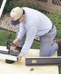 Person using Ratcheting Gutter Outlet Punch Tool Frame For Quick Holes In Aluminum Gutters With Angled Punch Blade And Ample Throat Clearance Bench Mount Ready Delivers Precise.032-Inch Fastener Holes And Smooth Cutting Action outdoors