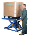 Rugged Electric Hydraulic Lift Table 48 X 48 Inch Steel Platform 5000 Lb Capacity with pallet and operator for loading.