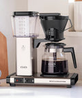 40 Oz Brushed Silver Coffee Brewer With Large Reservoir, kitchen counter view, showing carafe and hot plate, easy drip coffee maker
