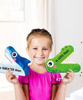 Child holding Magnetic Greater Than Less Than Equal Signs Math Set for classroom demonstrations, hands-on learning tool.
