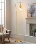 Gold Modern Floor Lamp With Globe Glass Shade, 68 Inch Tall Mid Century Standing Lamp For Living Room And Bedroom, Antique Brass Finish, LED Bulbs Included, Shatterproof Milk Glass Diffuser, Room Ready Vibe Home Decor beside a sofa in a cozy living room.