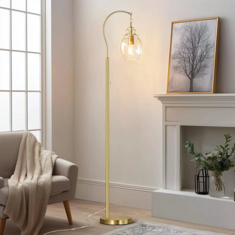 Gold Modern Floor Lamp With Globe Glass Shade, 68 Inch Tall Mid Century Standing Lamp For Living Room And Bedroom, Antique Brass Finish, LED Bulbs Included, Shatterproof Milk Glass Diffuser, Room Ready Vibe Home Decor beside a sofa in a cozy living room.