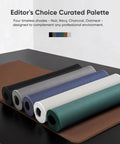 Rolled large gaming mouse pads in various colors on display with non-slip rubber bases and edge stitching.