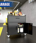 Heavy Duty Lockable Rolling Tool Storage Cabinet With Adjustable Inner Shelves And Floor Friendly Swivel Casters For Garage Workspace Organization Top Tier Mobile Locker In Black featuring tools and supplies inside.