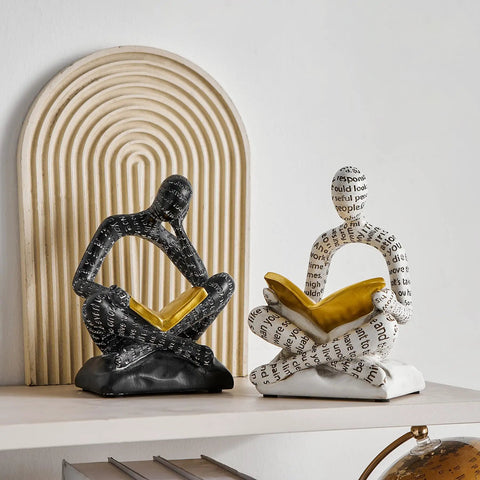 Heavy Duty Decorative Book Ends For Shelves With Thinker Statue Design in black and white on modern home office shelf.