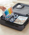 Open suitcase with Carry On Ready Travel Bottles Kit 16 Pack TSA Approved Leak Proof Silicone Squeezable Containers.