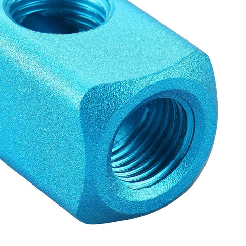 Close-up of aluminum air manifold block, highlighting one of its 1/4 inch PT threaded ports. Part of a 4-way 7-port system.