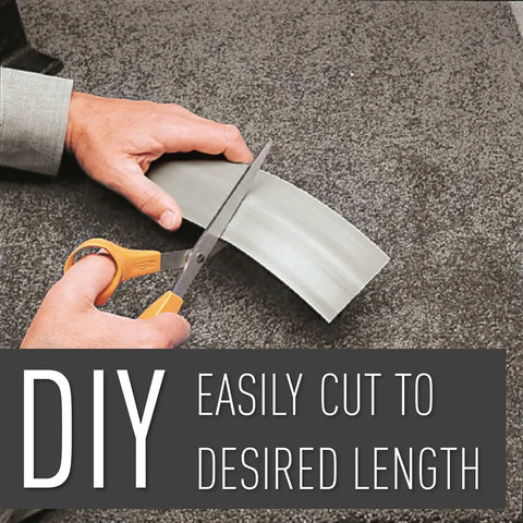 Hands cutting Floor Cord Management Kit With Corduct Cord Protector Wire Organizer, gray, rubber, on carpet, DIY use.
