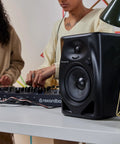 DM 50D BT 5 Inch Desktop Monitor System With Bluetooth for DJs, featuring compact design and dual sound modes on a tabletop